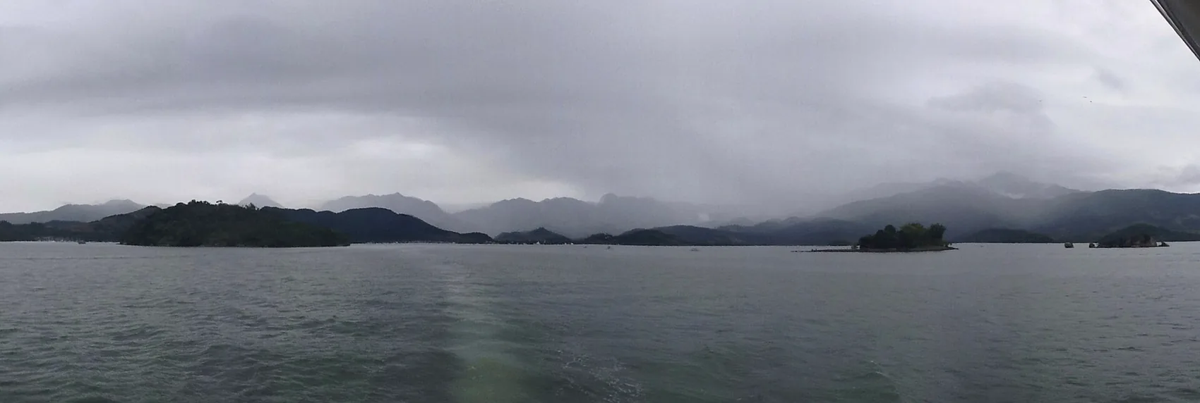 Boats anchored over clear water in the bay