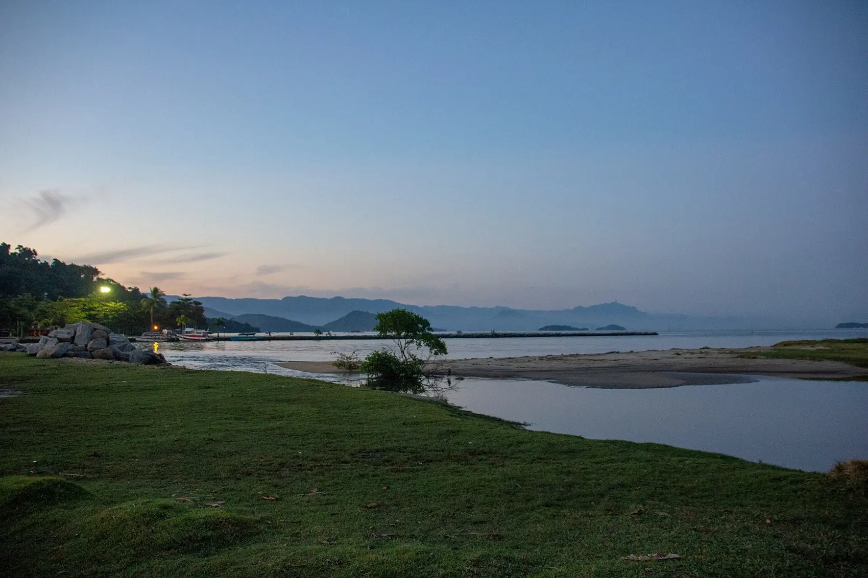Evening light where the river meets the bay at the edge of Paraty's old town.